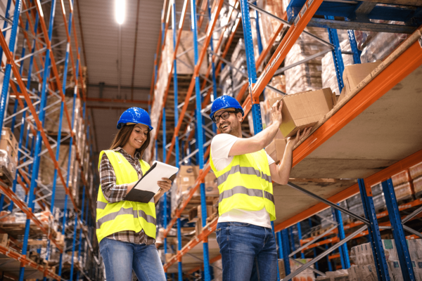 Two employees working in a social commerce fulfilment warehouse.