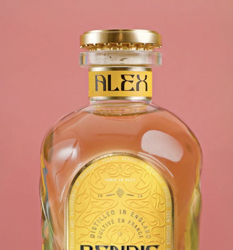 A bottle of Renais Gin with a personalised neck label saying 