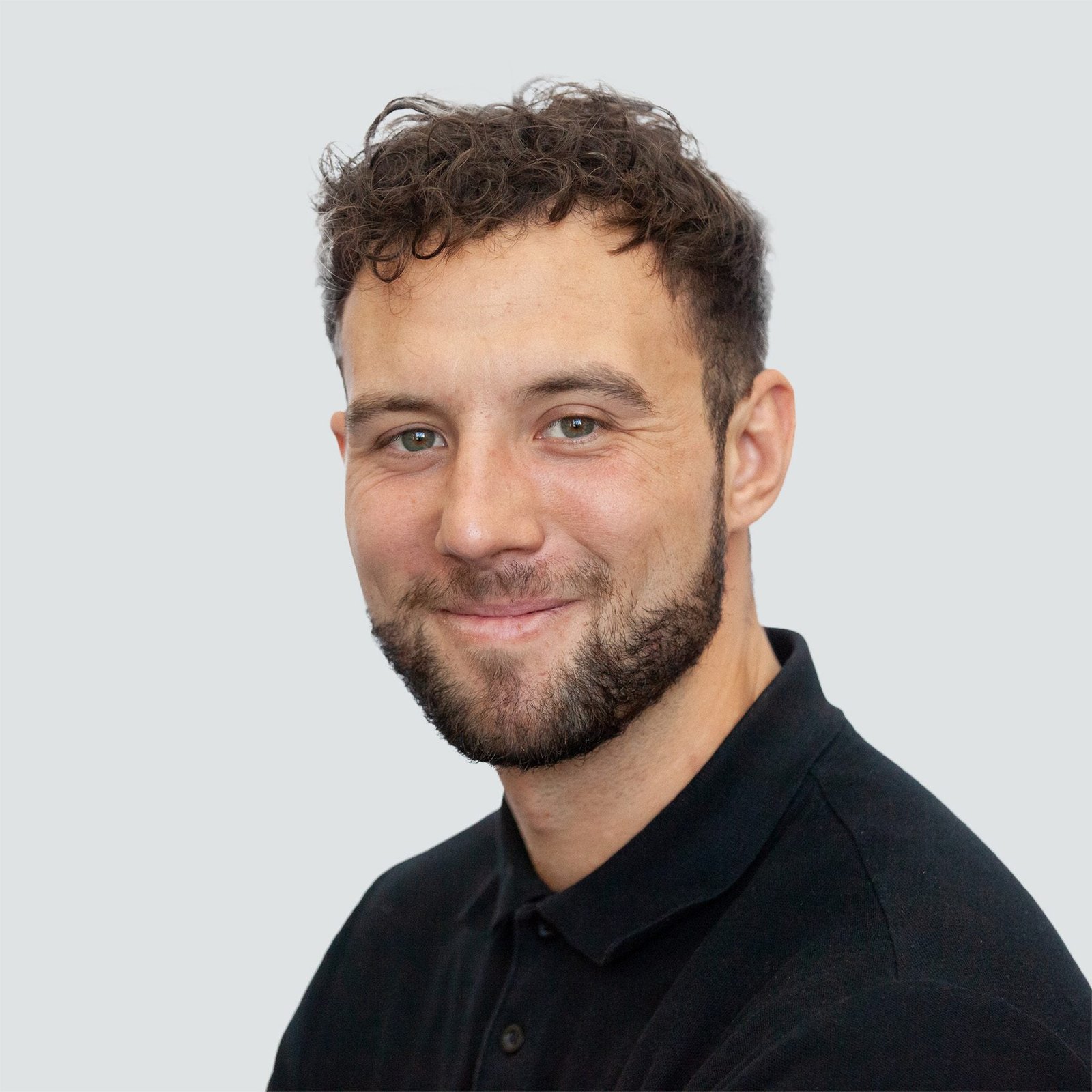 Portrait shot of man in black shirt.