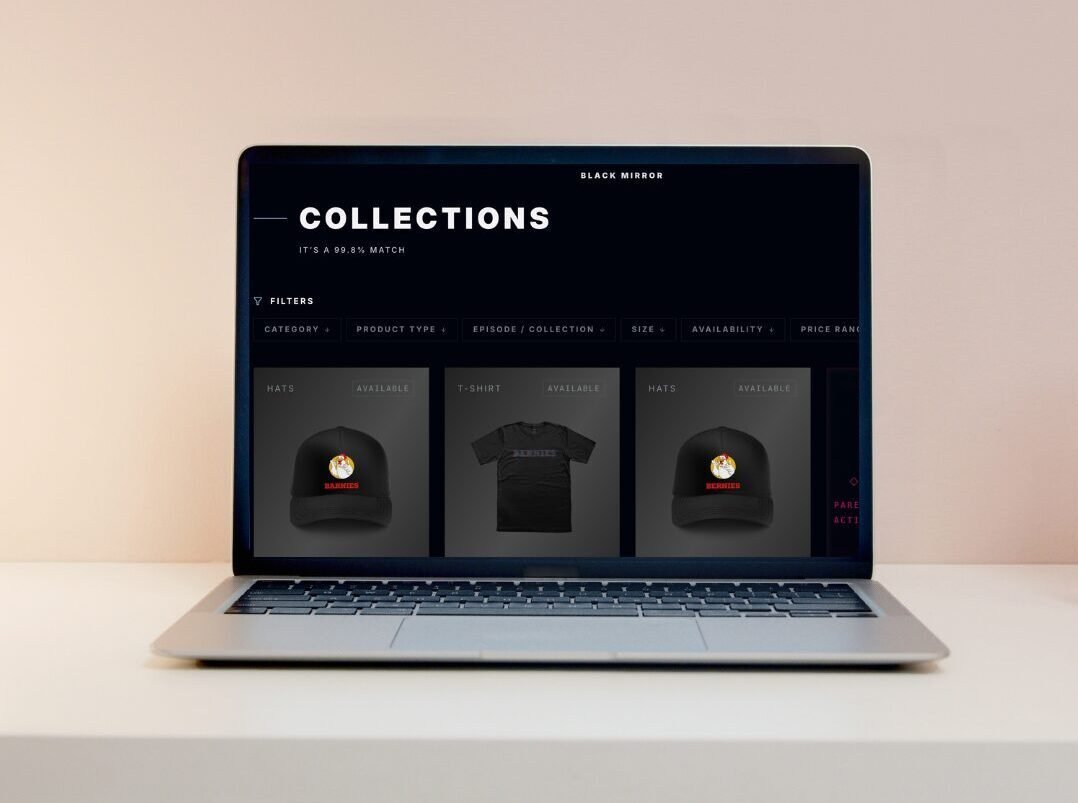 A laptop screen showing the Black Mirror merchandise store.